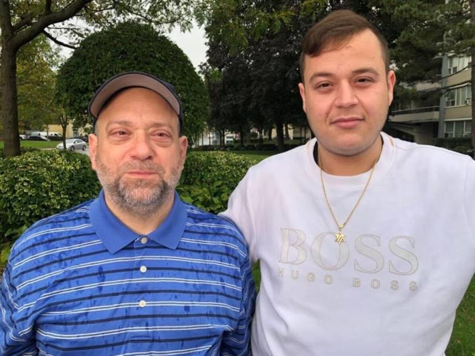 Ofer Penner, left, and his son Eli were left standing on a Florida pier after they were denied access to the MSC Divina, a cruise ship on which they'd been promised places. (Greg Bruce/CBC - image credit)