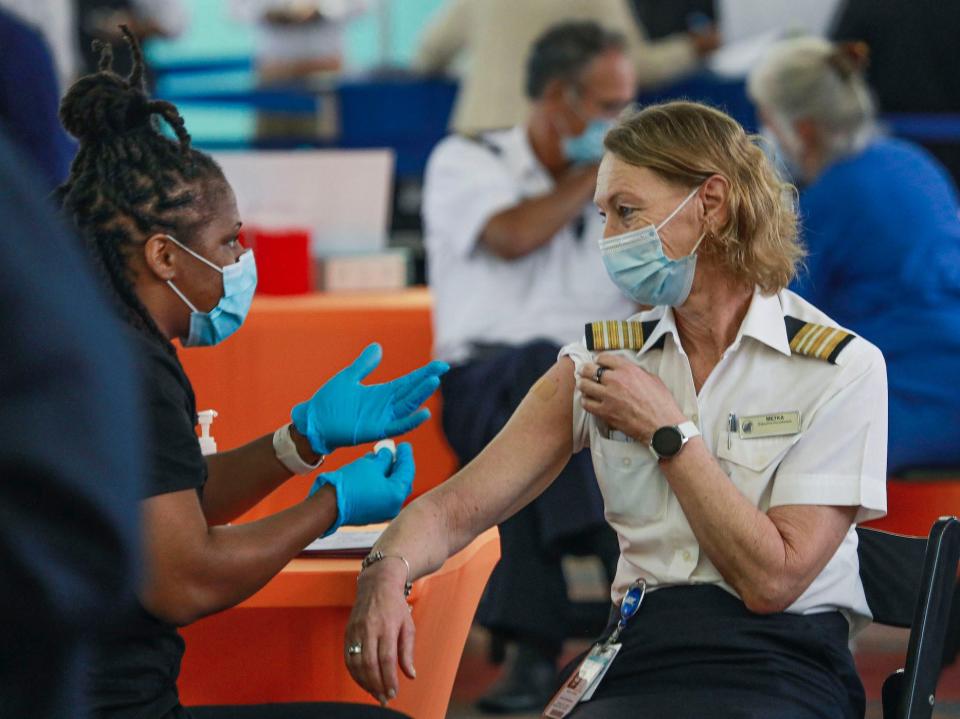 Cruise ship crewmember Metka Mocnik receives a Pfizer Covid-19 injection on May 19, 2021 in San Diego, California.
