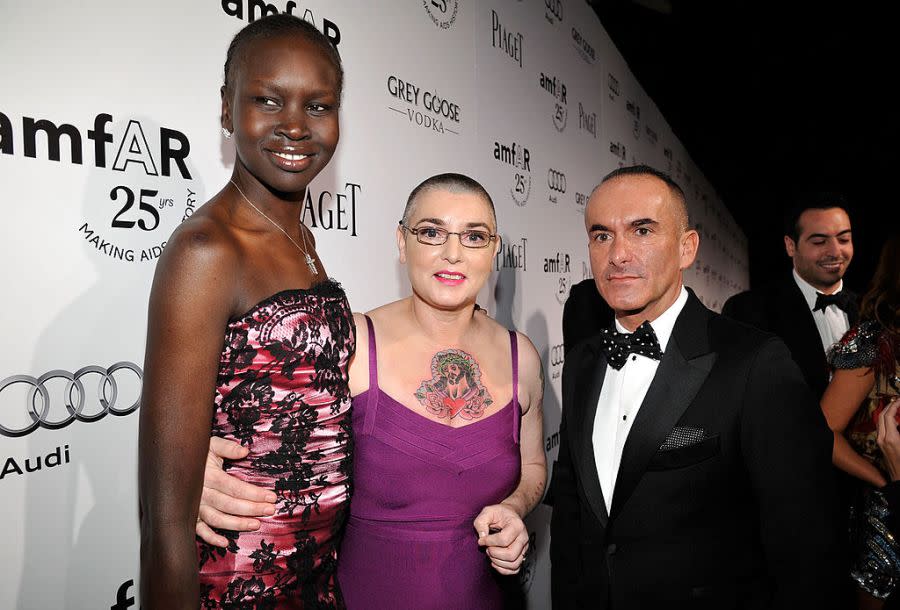 Singer Sinéad O’Connor (center) is shown in Los Angeles in 2011 with model Alek Wek (left) and Reca Group president Paolo Diacci at the amfAR Inspiration Gala at the Chateau Marmont. (Photo by John Sciulli/Getty Images for Reca Group)