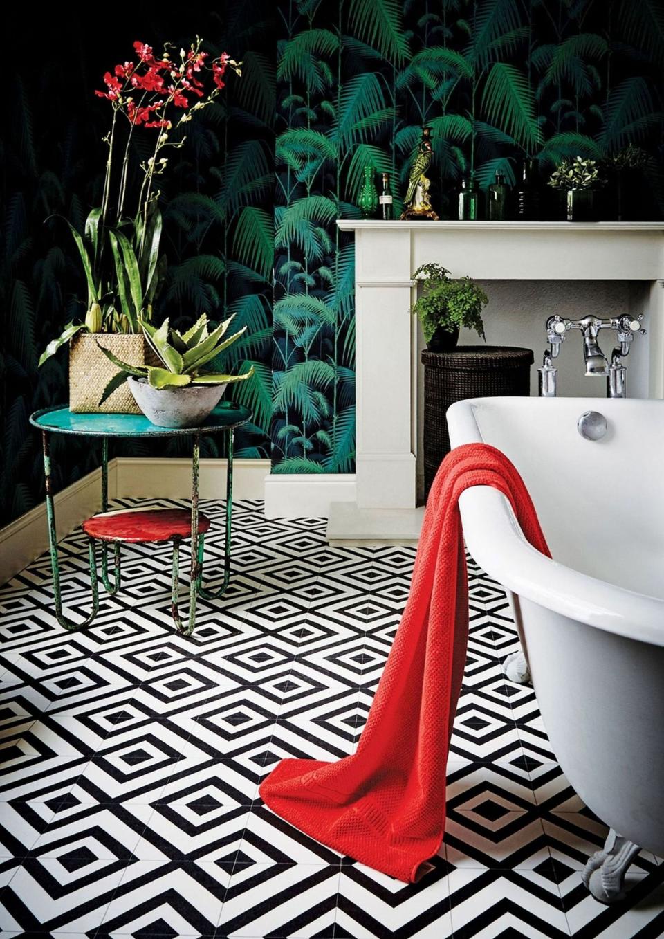 <p> Maximalism can work in any size of a bathroom. Team wallpaper with a contrasting floor and bring it all together with bold and unique accessories. Contrasting colors is another way to get that maximalist effect but be sure to still stick with a theme. In this bathroom, there is a clear color palette of reds and greens which work so well against each other. </p>