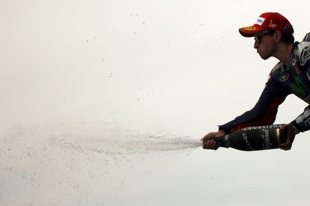 Yamaha MotoGP rider Jorge Lorenzo of Spain sprays champagne on the podium after winning the Spanish Grand Prix in Jerez de la Frontera, southern Spain, May 3, 2015. REUTERS/Jon Nazca