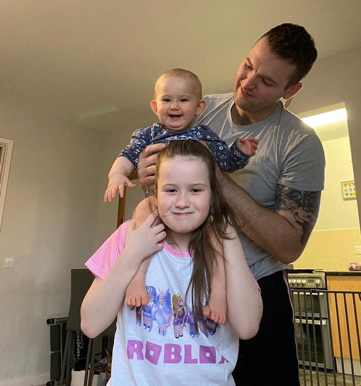 Sophia, pictured with her baby sister Isla and her dad, Lewis. (Megan Sayce/SWNS)