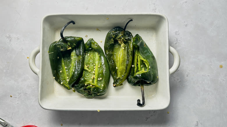 halved peppers in baking dish