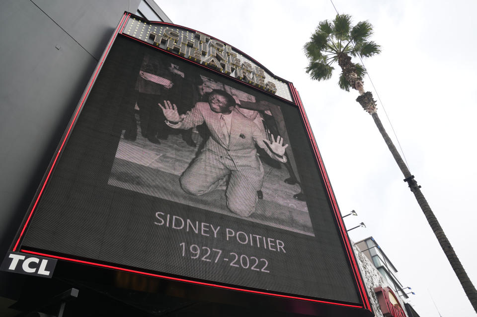 The TCL Chinese Theatre marquee displays a picture of the late actor Sidney Poitier, Friday, Jan. 7, 2022, in Los Angeles. Poitier, the first Black actor to win an Academy Award for best lead performance and the first to be a top box-office draw, died Thursday at 94. (AP Photo/Chris Pizzello)