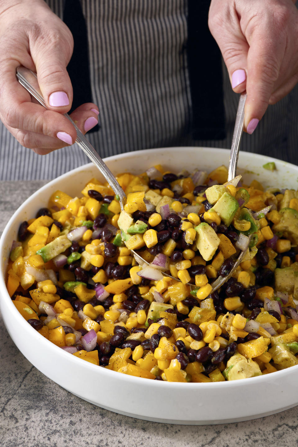 This 2021 image shows a recipe for bean salad, known as Cowboy Caviar. It's a protein-packed addition to any summer cookout. (Cheyenne M. Cohen via AP)