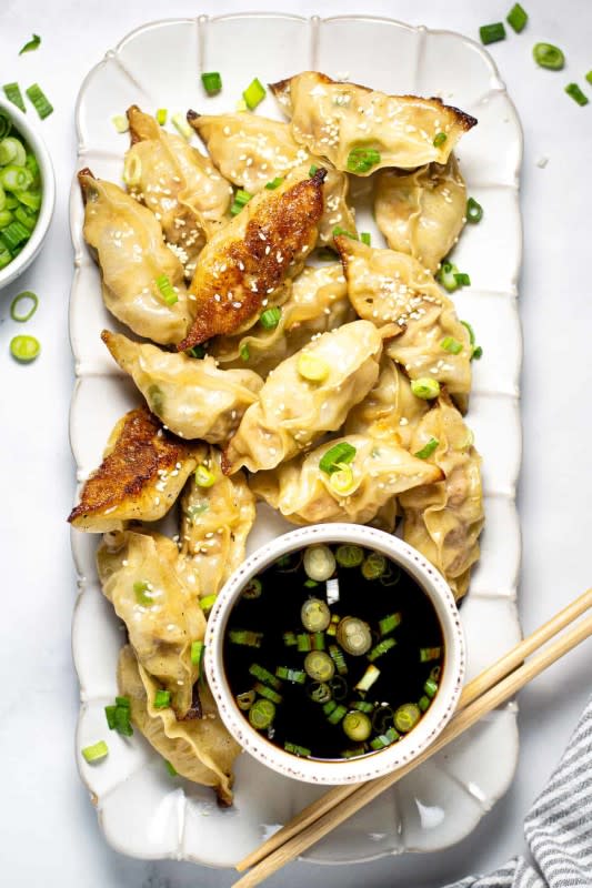 <p>Midwest Foodie Blog</p><p>Just over 30 minutes from start to finish these pork dumplings are simple, satisfying and loaded with flavor! They’re crispy yet tender making them the perfect main course or party appetizer!</p><p><strong>Get the recipe: <a href="https://midwestfoodieblog.com/pan-fried-pork-dumplings/" rel="nofollow noopener" target="_blank" data-ylk="slk:Quick and Easy Pork Dumplings;elm:context_link;itc:0;sec:content-canvas" class="link "><em>Quick and Easy Pork Dumplings</em></a></strong></p>