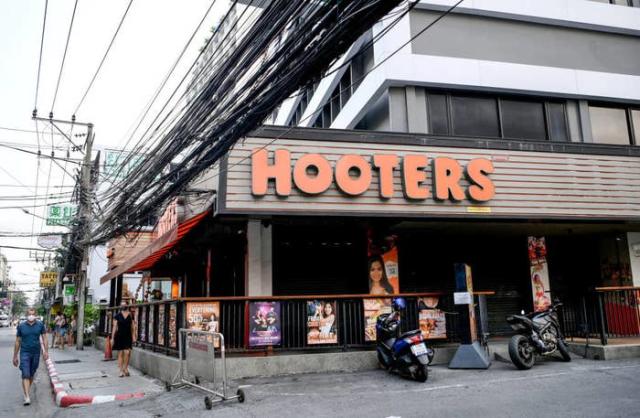 Hooters waitress slams new 'crotch string' uniform: 'Oh look, a