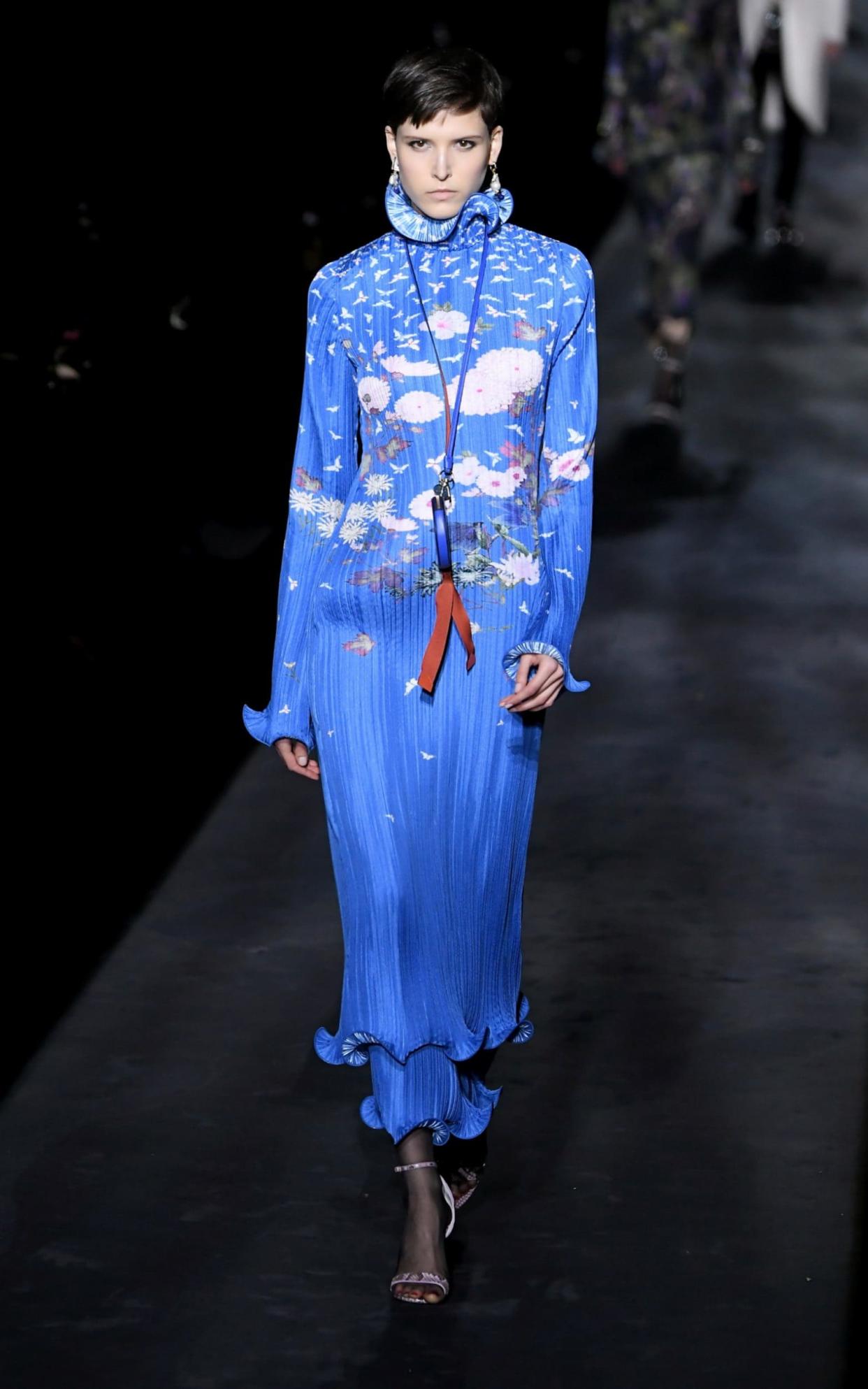 A model wears a printed blue plisse dress at Givenchy  - WireImage