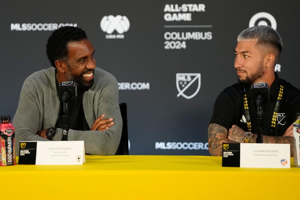 Jul 22, 2024; Columbus, Ohio, USA; MLS head coach Wilfried Nancy of the Columbus Crew and MLS midfielder Luciano Acosta of FC Cincinnati (11) speak during the MLS All-Star press conference at Lower.com Field. Mandatory Credit: Adam Cairns-USA TODAY Sports