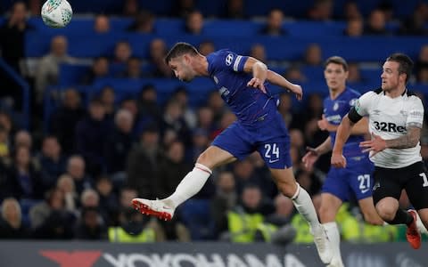 Chelsea's English defender Gary Cahill heads the ball during the English League Cup football match between Chelsea and Derby County - Credit: AFP