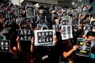 Graduates attend a ceremony to pay tribute to Chow Tsz-lok, 22, an university student who fell during protests at the weekend and died early on Friday morning, at the Hong Kong University of Science and Technology, in Hong Kong