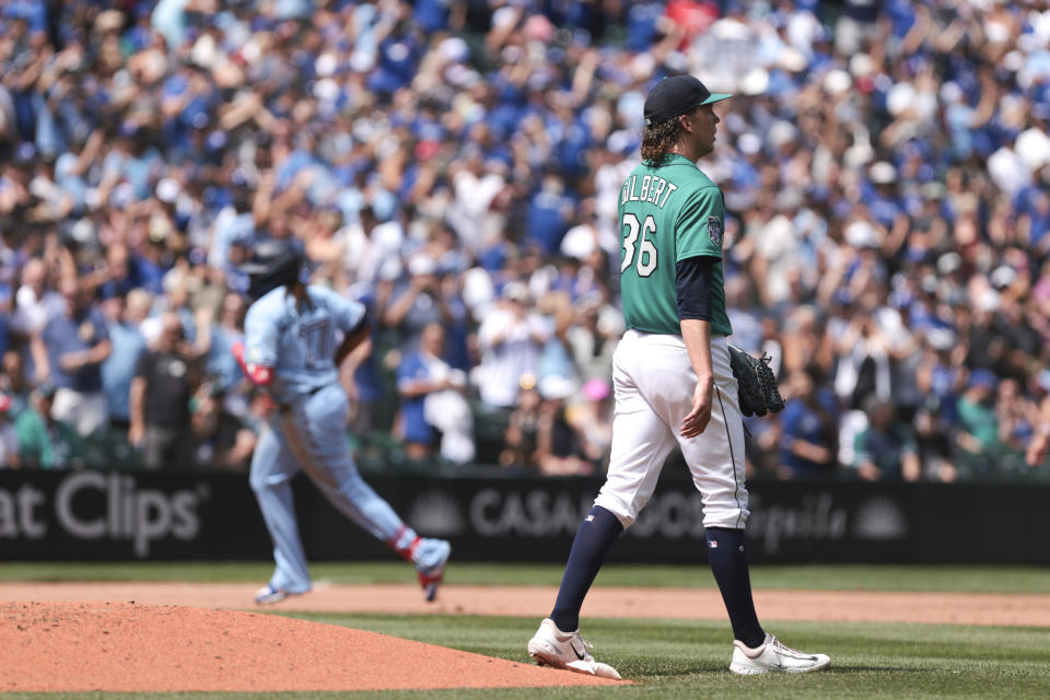 Seattle Mariners starting pitcher Logan Gilbert (36) looks on as Toronto Blue Jays' Vladimir Guerrero Jr. rounds third after hitting a solo home run during the fifth inning of a baseball game, Saturday, July 22, 2023, in Seattle. (AP Photo/Jason Redmond)