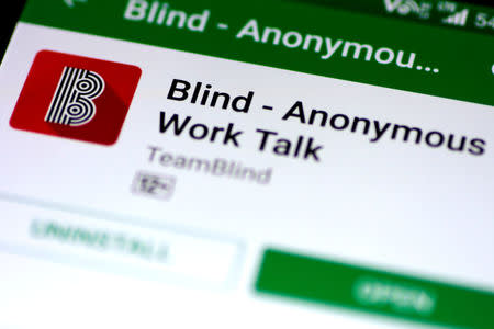 FILE PHOTO: The Blind anonymous work talk application is seen in the Google Play store on a mobile phone in this illustration photo February 6, 2018. REUTERS/Thomas White/Illustration/File Photo