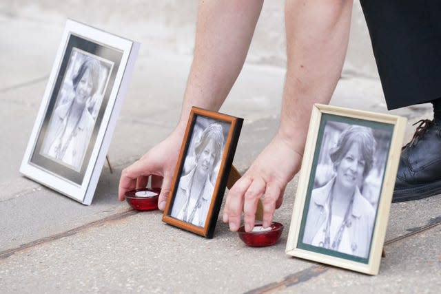 People attending a vigil for Ruth Perry outside Ofsted's offices in central London after her death