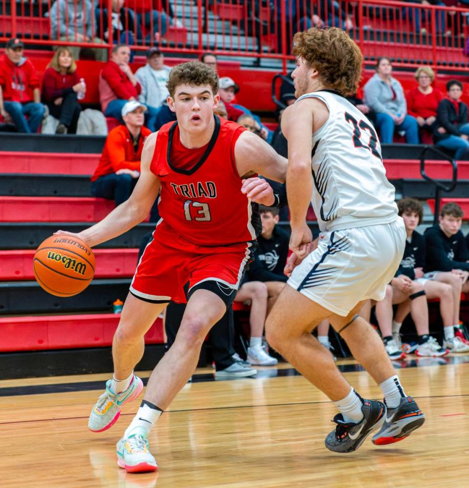 Triad’s McGrady Noyes drives to the basket against Highland’s Cade Altadonna during Friday night’s Mississippi Valley Conference game. The Knights ultimately posted a 50-37 victory.