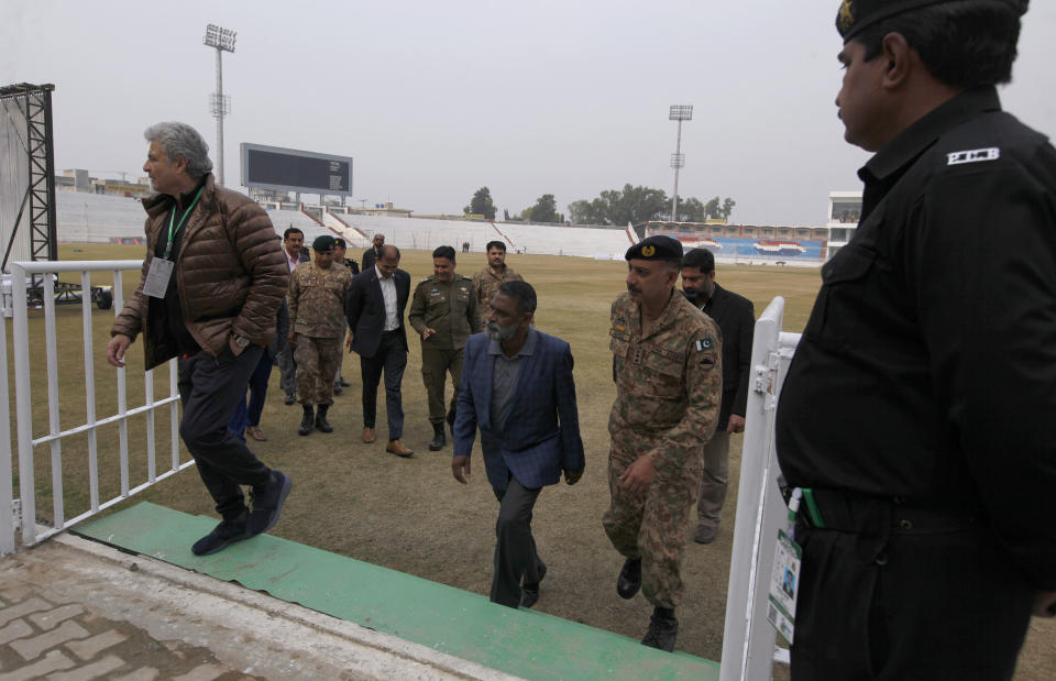 Pakistan security officials brief Hussain Imam, center, head of Bangladesh security team, regarding security arrangements for 1st cricket test between Pakistan and Bangladesh, during their visit to Pindi stadium in Rawalpindi, Pakistan, Tuesday, Feb. 4, 2020. (AP Photo/Anjum Naveed)