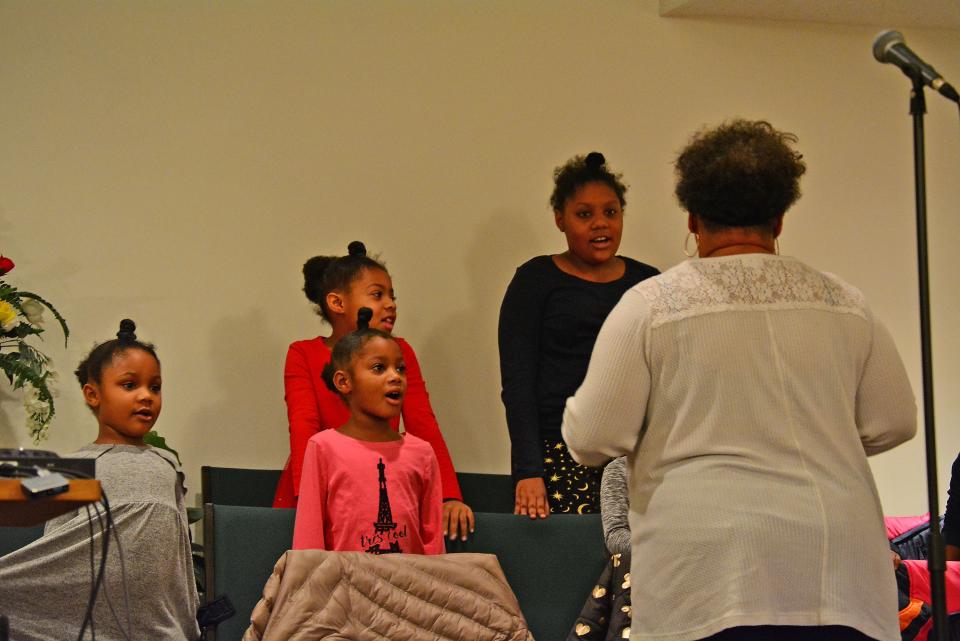 Students from Dream Tree Academy perform "Hush (Somebody's Calling My Name)" on Monday during the Martin Luther King Jr. celebration at St. Luke United Methodist Church.