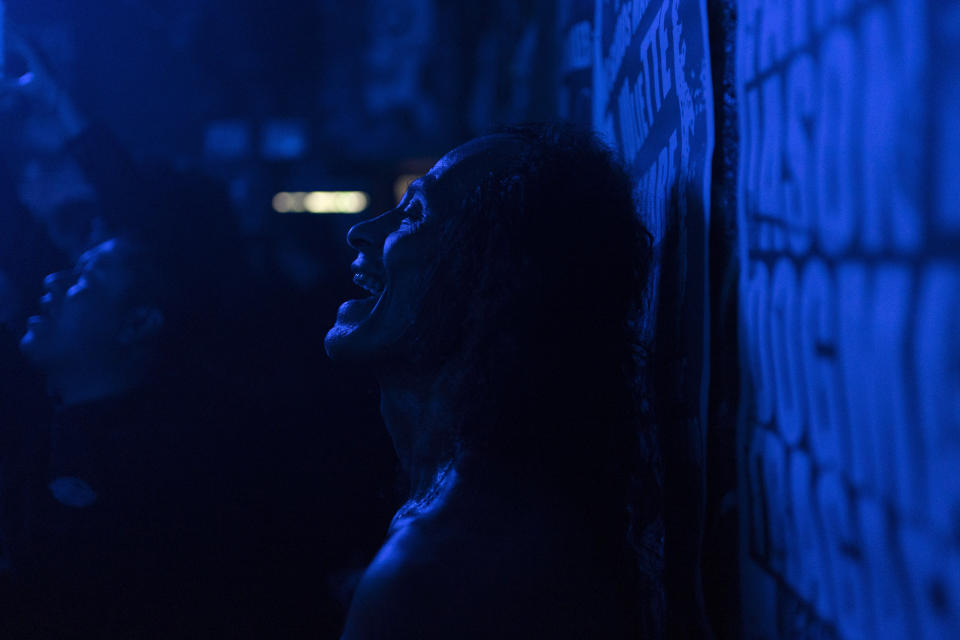 A fan of the Mexican Punk Rock band Seguimos Perdiendo sings during one of the last active weekends at the iconic counterculture venue Multiforo Alicia in Mexico City, Friday, Feb. 17, 2023. The space was inspired by the leftist self-managed occupied social centers in Italy in the 1980s and similar spaces called gaztetxes in the Basque Country, an autonomous region in Spain. (AP Photo/Eduardo Verdugo)