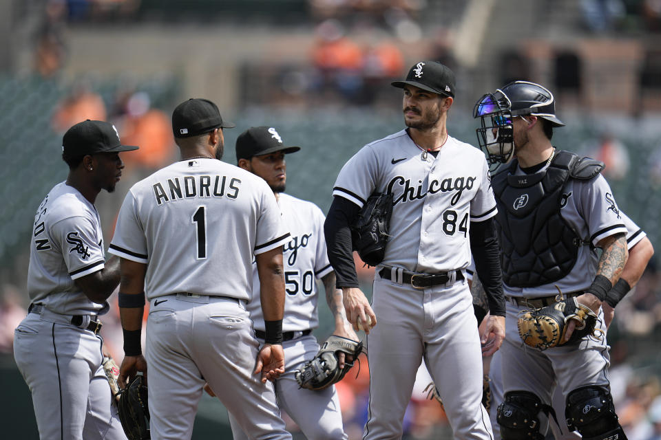 Chicago White Sox starting pitcher Dylan Cease (84) gathers with infielders near the mound during a visit in the first inning of a baseball game against the Baltimore Orioles, Wednesday, Aug. 30, 2023, in Baltimore. (AP Photo/Julio Cortez)