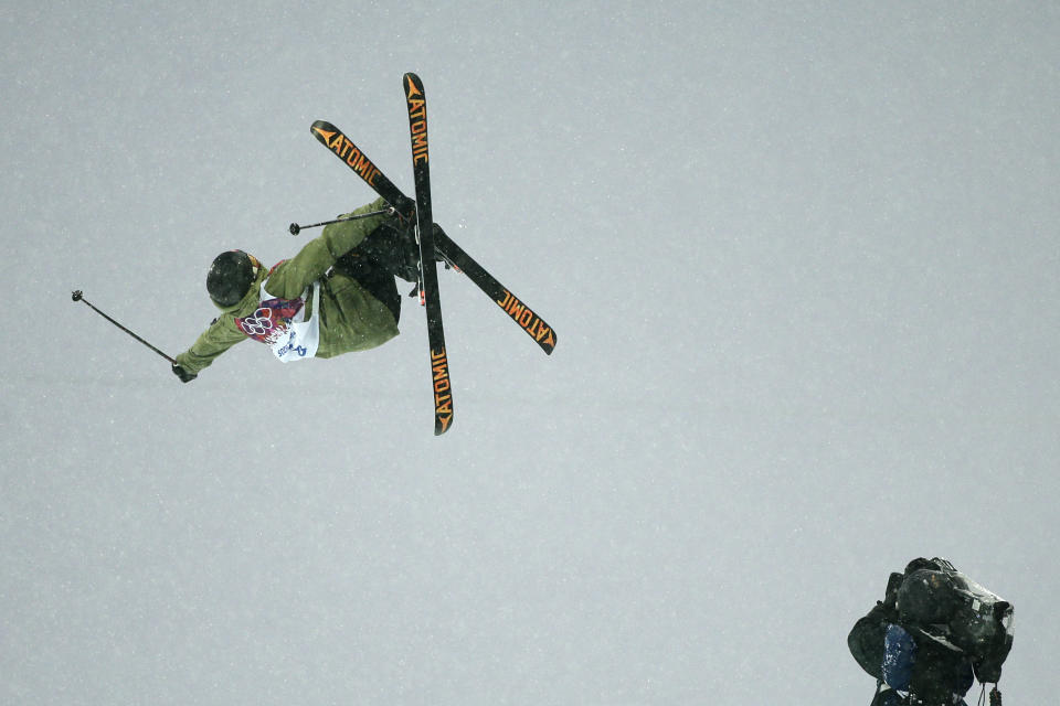 Switzerland's Yannic Lerjen catches air as he competes during the men's freestyle skiing halfpipe qualification at the Rosa Khutor Extreme Park, at the 2014 Winter Olympics, Tuesday, Feb. 18, 2014, in Krasnaya Polyana, Russia. (AP Photo/Jae C. Hong)