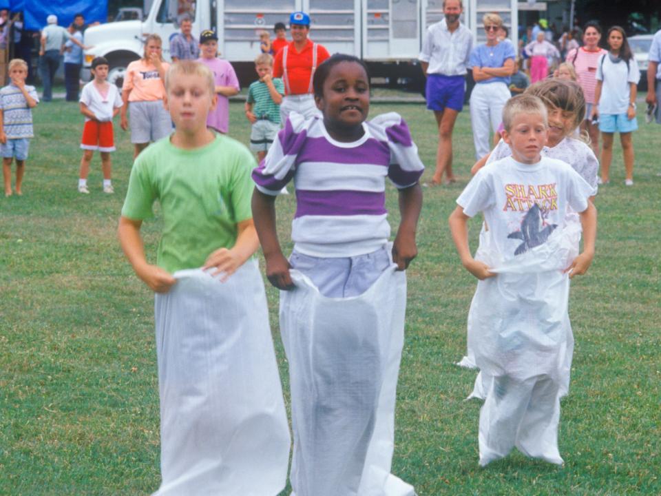 Children in a potato sack race, in East Shore, Maryland, July 4, 1991.