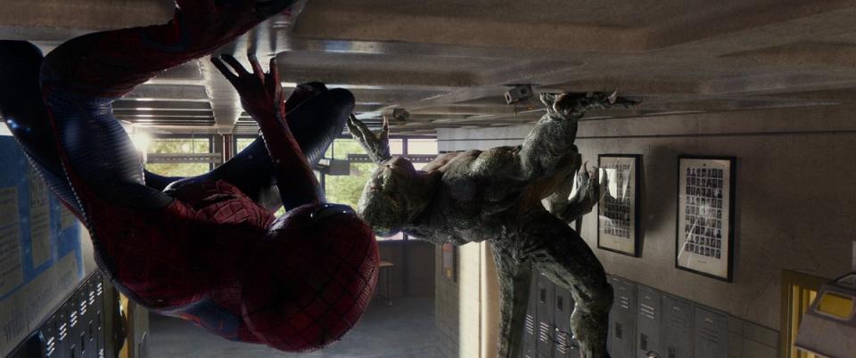 Spider-Man (Andrew Garfield) fights the Lizard in his high school corridors in The Amazing Spider-Man (2012)