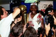 Michael Jordan with the Larry O'Brien trophy moments after the Bulls beat the Portland Trailblazers in Game 6 of the 1992 NBA Finals. (Getty Images)