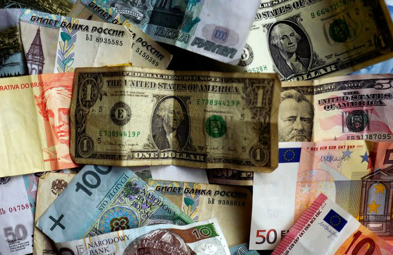 FILE PHOTO: Bank notes of different currencies are photographed in Frankfurt, Germany, in this illustration picture