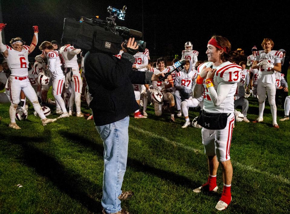 Holliston High School senior captain and quarterback TJ Kiley is interviewed after the win against Hopkinton, 21-19, on Oct. 28, 2022.