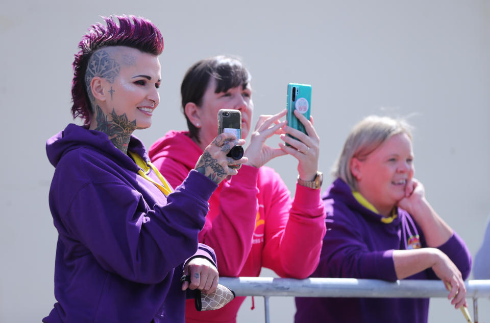 <p>Onlookers take pictures of the Duchess of Cornwall during a visit to the Kilcooley Women's Centre, Bangor, where she met staff and learn about the groups' work from its members. Picture date: Wednesday May 19, 2021.</p>
