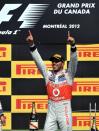 Winner McLaren Mercedes driver Lewis Hamilton of Britain celebrates on the podium after the Canadian Formula One Grand Prix on June 10, 2012 at the Circuit Gilles Villeneuve in Montreal. AFP PHOTO/Stan HONDASTAN HONDA/AFP/GettyImages