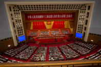 FILE - In this May 28, 2020, file photo, delegates and Chinese leaders attend the closing session of China's National People's Congress (NPC) in Beijing. The annual gathering of the National People's Congress and its advisory body, the Chinese People's Political Consultative Conference, brings handpicked delegates from across the country to discuss governing priorities and receive instructions from the ruling Communist Party leadership. (AP Photo/Mark Schiefelbein, File)