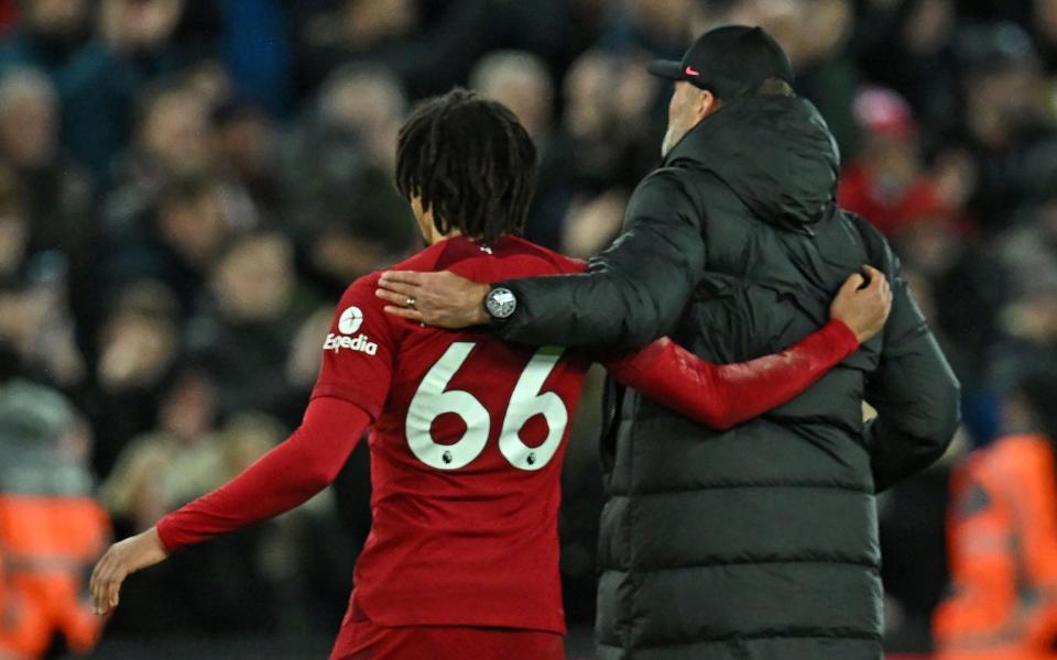 Liverpool's Jurgen Klopp (R) and Liverpool's defender Trent Alexander-Arnold (L) celebrate on the pitch - Getty Images/Paul Ellis