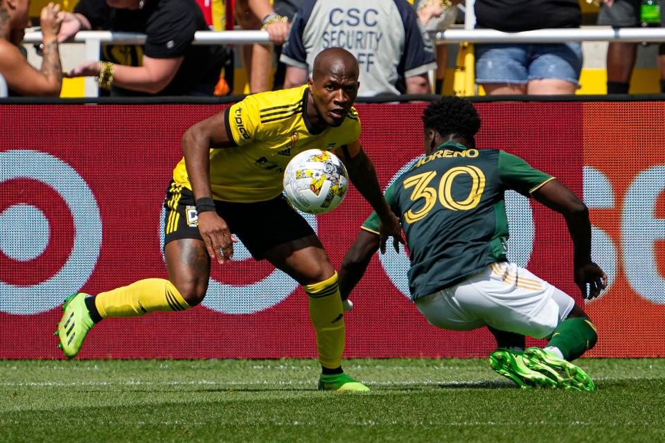 Sep 18, 2022; Columbus, Ohio, USA; Columbus Crew midfielder Darlington Nagbe (6) kicks the ball away from Portland Timbers midfielder Santiago Moreno (30) during the first half of the MLS game at Lower.com Field. Mandatory Credit: Adam Cairns-The Columbus Dispatch