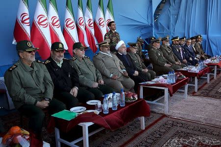 Iranian President Hassan Rouhani (5th L) attends a military parade marking National Army Day in Tehran, Iran, April 17, 2016. REUTERS/President.ir/Handout via Reuters