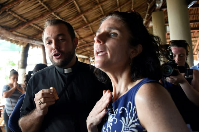 Rebecca Gomperts (R), founder of the Dutch organization Women on Waves, speaks with seminarian Gil Hernandez after a press conference at the Pez Vela Marina in the port of San Jose, Escuintla department on February 23, 2017