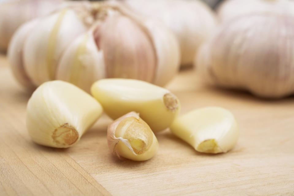 <p>Garlic is part of the <em>Allium</em> family and is closely related to shallots, leeks and onions. The fructans found in garlic are what give it its prebiotic effects. A <a href="https://www.hindawi.com/journals/tswj/2015/289267/" rel="nofollow noopener" target="_blank" data-ylk="slk:report published in The Scientific World Journal;elm:context_link;itc:0;sec:content-canvas" class="link ">report published in <em>The Scientific World Journal</em></a> describes fructans to be health-promoting food ingredients that act as prebiotics in the gut. "They're also antimicrobial and help balance blood sugar," says Zibdeh. </p><p>There are additional <a href="https://www.goodhousekeeping.com/health/diet-nutrition/a40447277/garlic-health-benefits/" rel="nofollow noopener" target="_blank" data-ylk="slk:health benefits of garlic;elm:context_link;itc:0;sec:content-canvas" class="link ">health benefits of garlic</a>: You'll find traces of micronutrients like manganese, vitamin B6 and potassium, and garlic is known to protect against the common cold due to its naturally-occurring bioactive compounds. </p><p>It’s best eaten raw, so crush or mince a clove and make <a href="https://www.goodhousekeeping.com/food-recipes/easy/a27557590/herbed-tomato-vinaigrette-recipe/" rel="nofollow noopener" target="_blank" data-ylk="slk:a flavorful salad dressing;elm:context_link;itc:0;sec:content-canvas" class="link ">a flavorful salad dressing</a>, chunky salsa or a white bean dip.</p>
