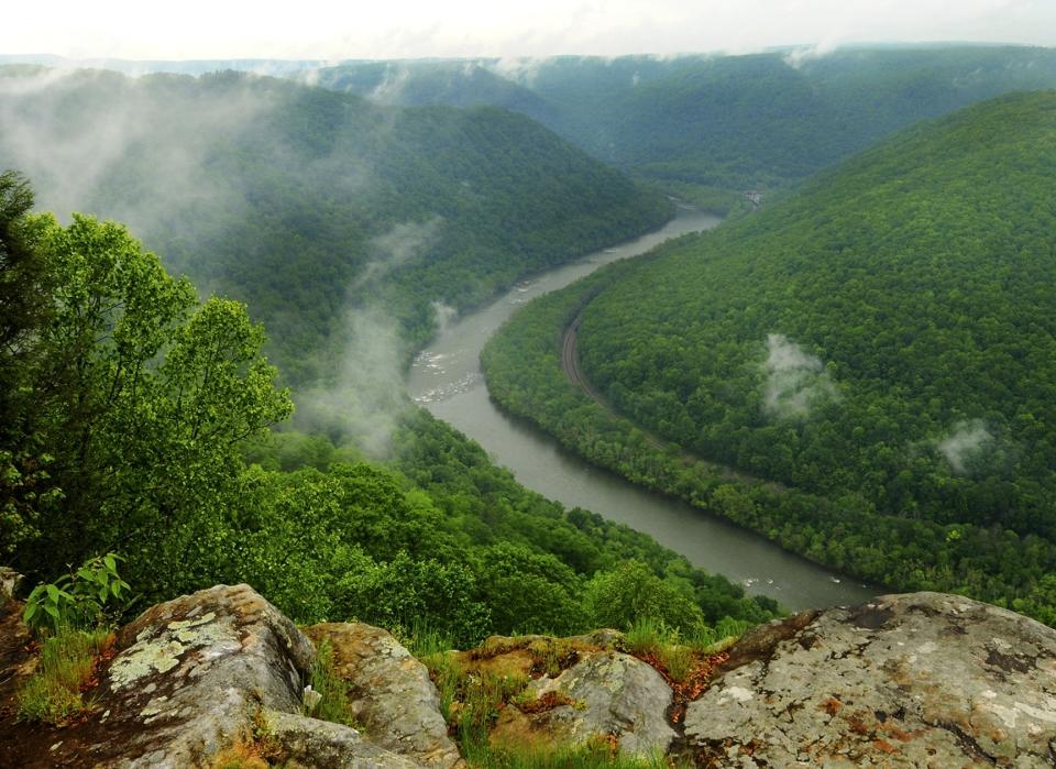 FILE - This May 9, 2012, file photo, shows the Grandview State Park overlooking the New River Gorge National River in Grandview, W.Va. The state offers numerous trails for hiking and other spots with scenic views. With West Virginia poised to lose another congressional seat due to its long, steady population decline, Republican lawmakers are convinced a massive tax cut is the key to reversing the trend. (Kenny Kemp/Charleston Gazette-Mail via AP, File)