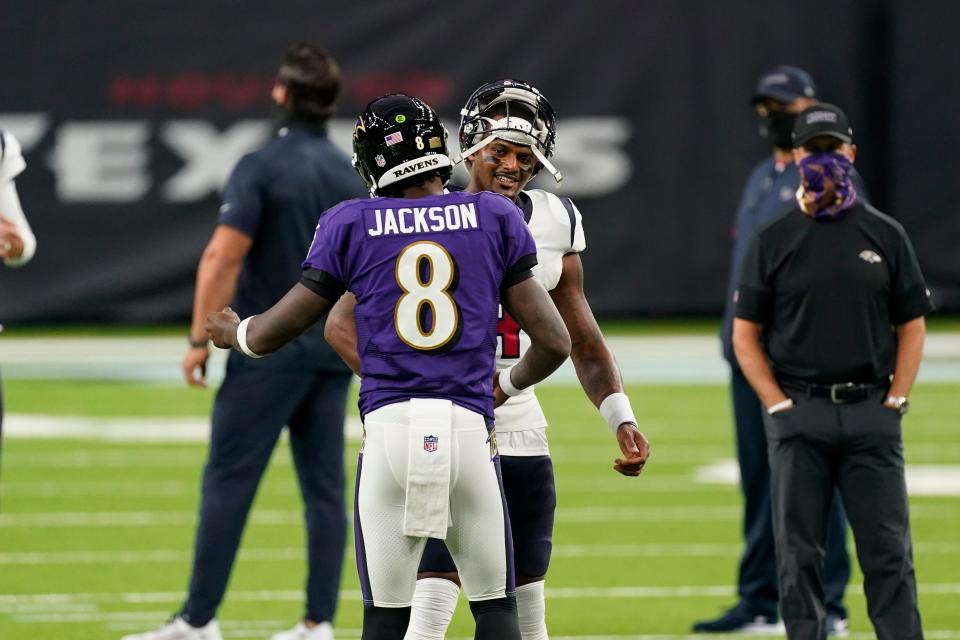Baltimore Ravens quarterback Lamar Jackson (8) greets Houston Texans quarterback Deshaun Watson (4) before a game Sept. 20, 2020, in Houston.