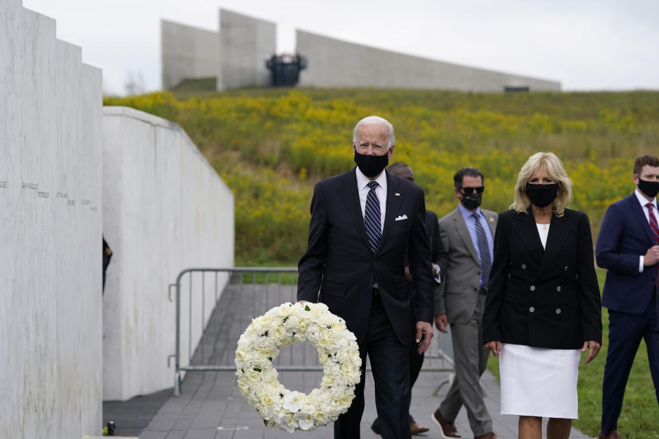 Democratic presidential candidate and former Vice President Joe Biden and his wife Jill Biden prepare to lay a wreath at the Flight 93 National Memorial in Shanksville, Pa., Friday, Sept. 11, 2020, to commemorate the 19th anniversary of the Sept. 11 terrorist attacks. (AP Photo/Patrick Semansky)