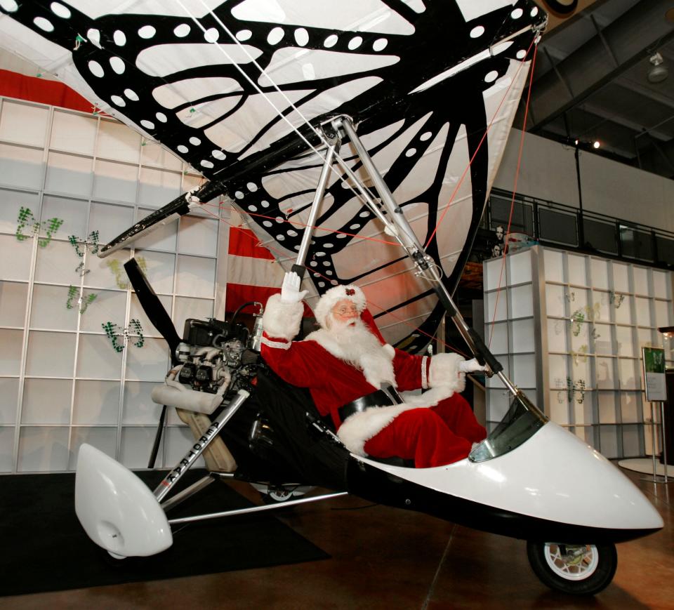 Brady White, aka Michael J. Chellel, poses in an ultralight aircraft at the Neiman Marcus Christmas Book press preview in Dallas in October 2007.