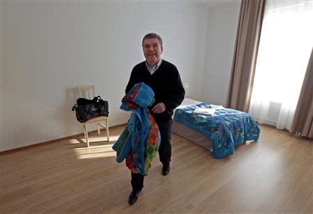 International Olympic Committee (IOC) President Thomas Bach leaves his bedroom in the Coastal Cluster Olympic Village in Sochi, February 4, 2014. REUTERS/Eric Gaillard