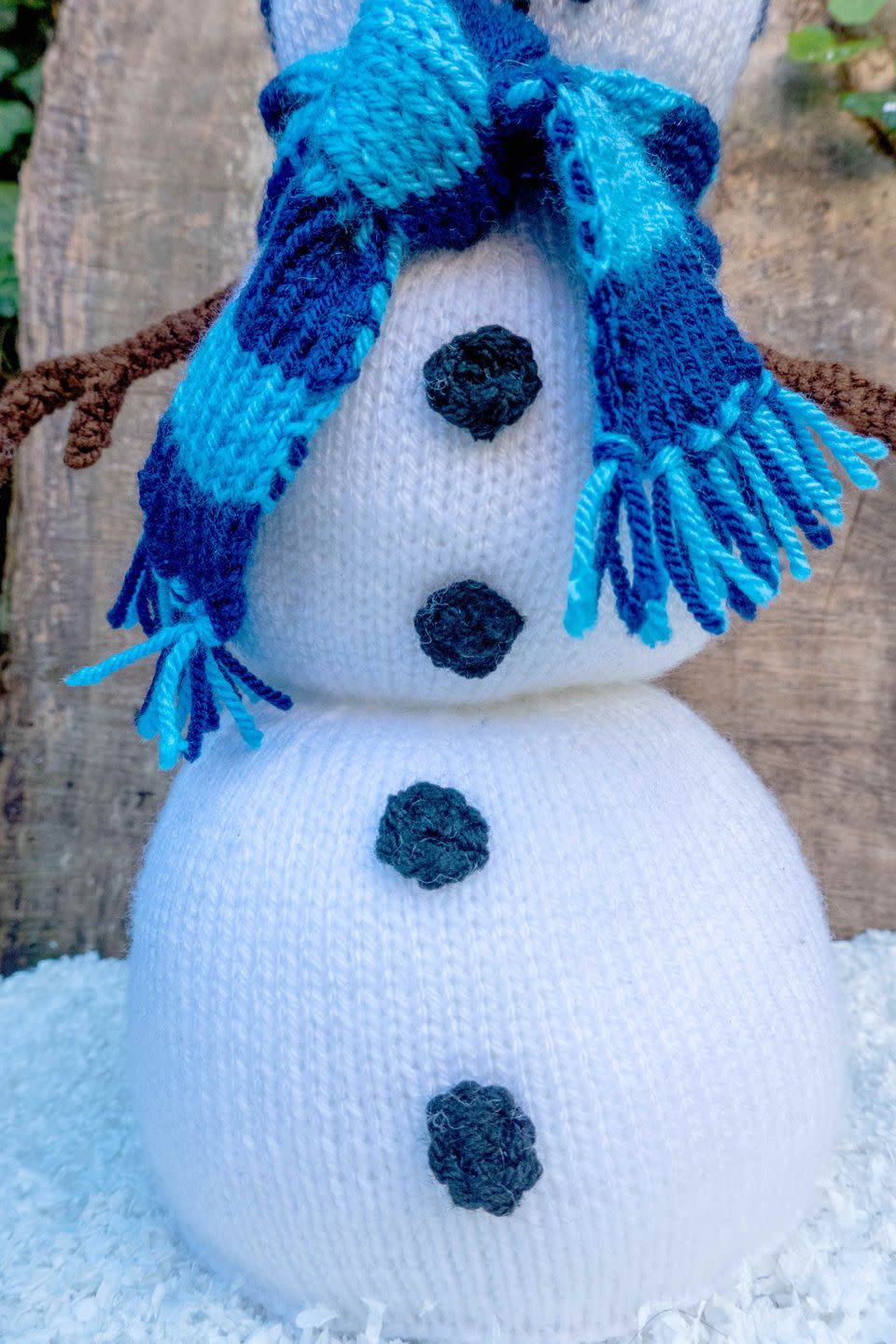 buttons on a knitted snowman