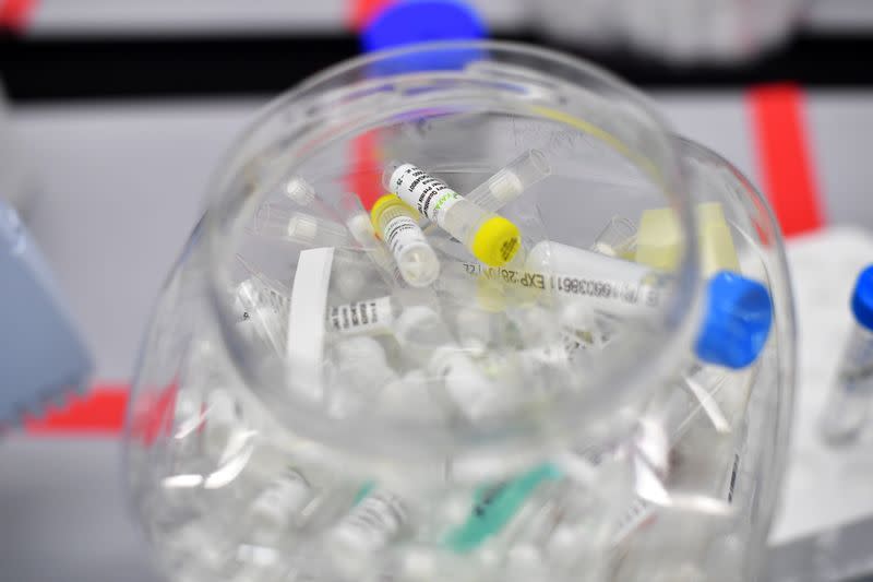 Used vials are seen at a laboratory where they sequence the novel coronavirus genomes in Cambridge