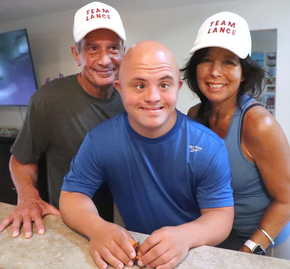 Anni Suadi, pictured with her husband, Robert Suadi, and son, Lance Avery, has filed state and federal complaints alleging Volusia County Schools discriminates against Avery, who has Down syndrome, and other students with disabilities who attend Seabreeze High School in Daytona Beach, on Tuesday, Sept. 27, 2022.