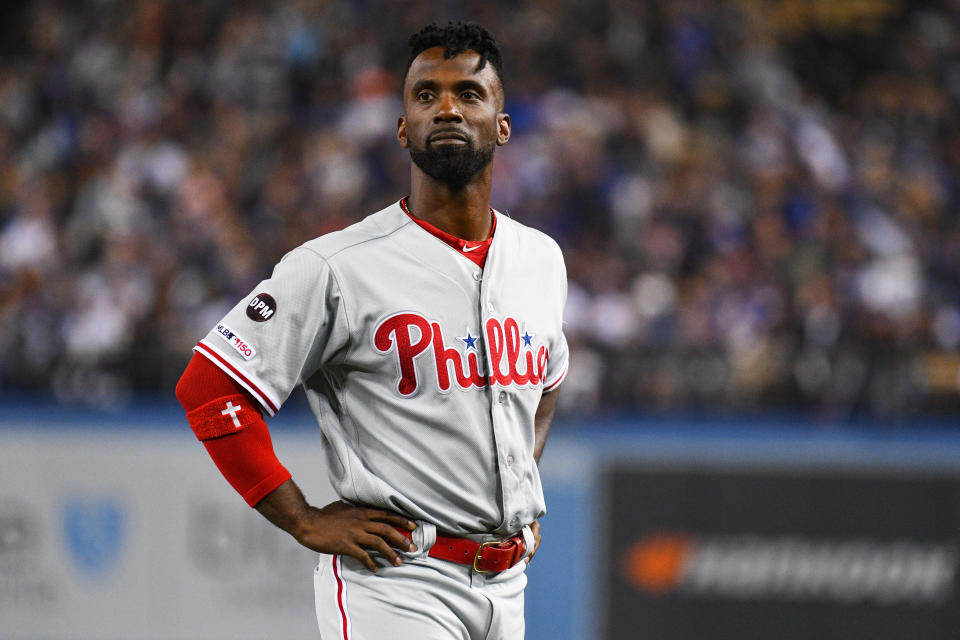 Andrew McCutchen injured his knee while attempting to run back to first base in the first inning against the Padres on Monday night.
