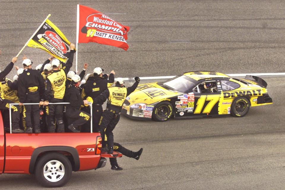 Kenseth's crew cheers its driver after they won the Winston Cup title Nov. 9, 2003.