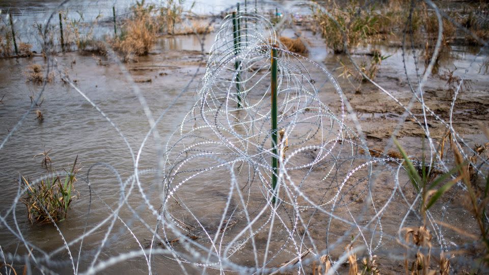 Razor wire is seen near the Rio Grande on February 3, 2024 at Shelby Park in Eagle Pass, Texas. - Sergio Flores/AFP/Getty Images