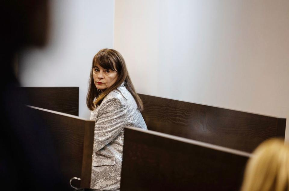 Activist, Justyna Wydrzyńska sits at the court in Warsaw, Poland, on Tuesday March 14, 2023. A court on Tuesday convicted Wydrzyńska for helping a victim of domestic violence access abortion pills in Poland, and sentenced her to eight months of community service.