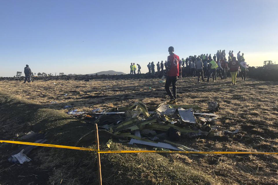 Rescuers search at the scene of an Ethiopian Airlines flight that crashed shortly after takeoff near Addis Ababa (Picture: AP)